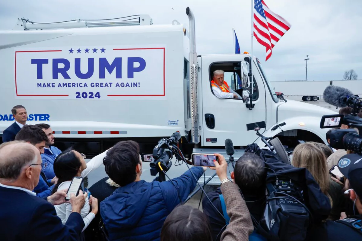 an image of Trump Addresses the Media from a Garbage Truck Following Biden's "Garbage" Comment